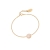 Gold bracelet with round white opal detail