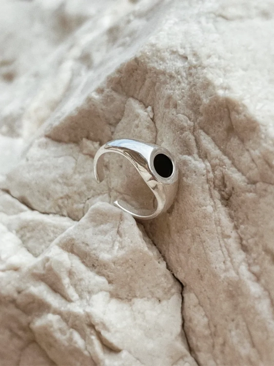Elegant silver signet ring with dark chocolate flint in simple design.
