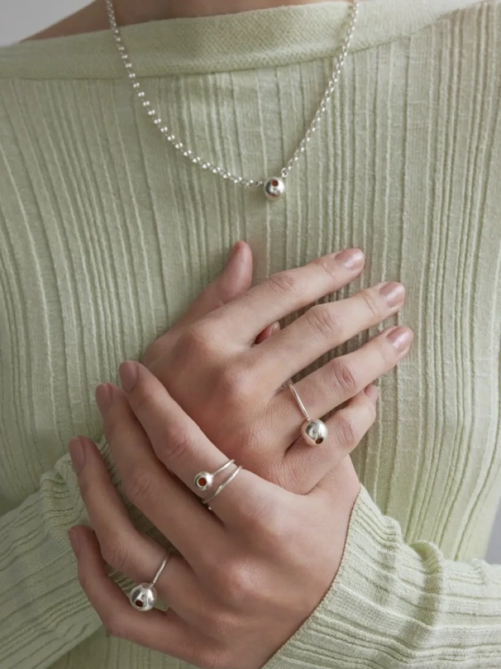 Statement silver ring with amber-inlaid sphere