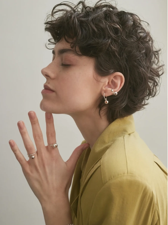 Modern sterling silver ear cuff with spheres styled on the ear