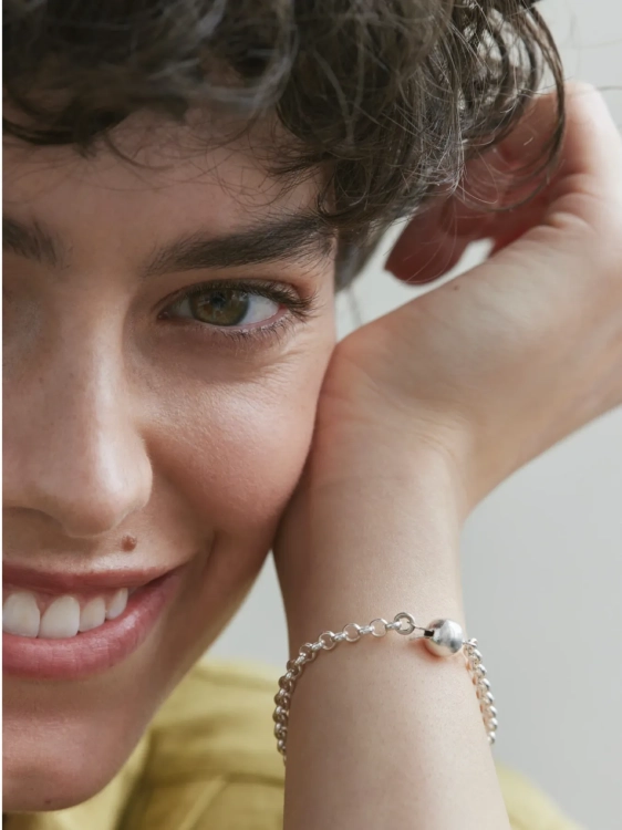 Sterling silver chain bracelet with sphere worn on the wrist