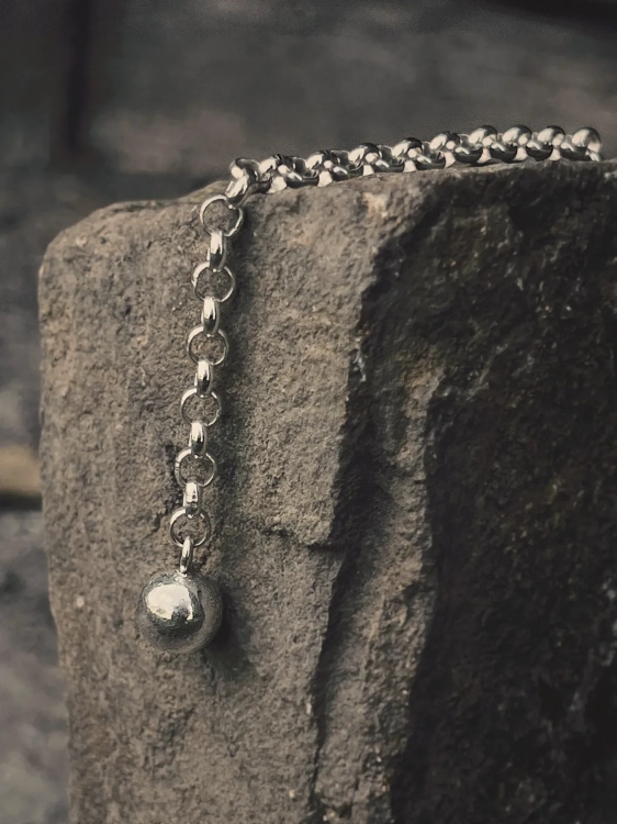 Modern sterling silver bracelet with sphere, close-up detail