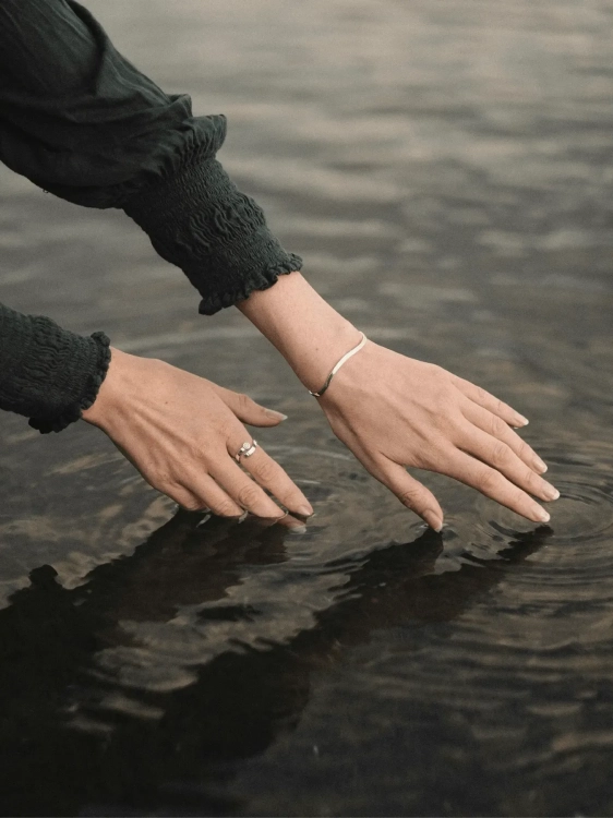 Minimalist silver wave bracelet styled for everyday wear