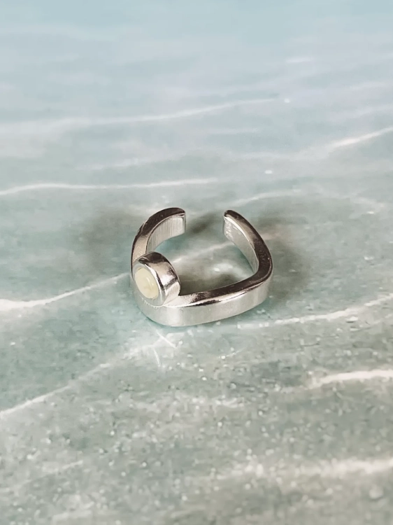 Sterling silver ear cuff with light amber, close-up detail