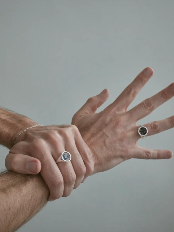 Silver signet ring with meteorite as a symbolic accent