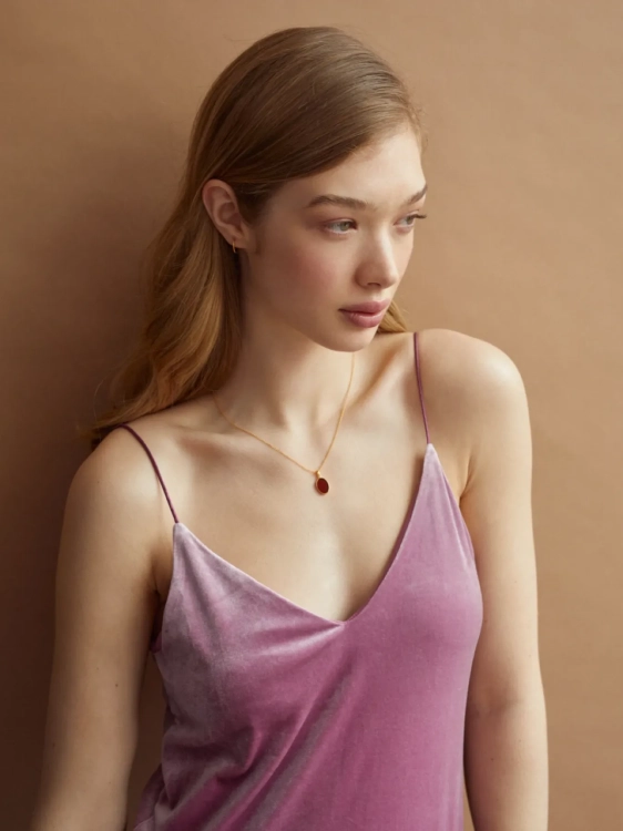 Gold-plated Baltic amber necklace styled with an elegant outfit