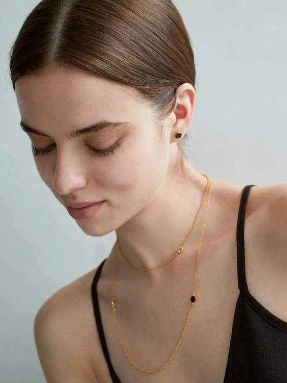 Small gold-plated stud earrings with Polish black flint