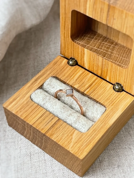 Gold meteorite ring presented in a handcrafted wooden box
