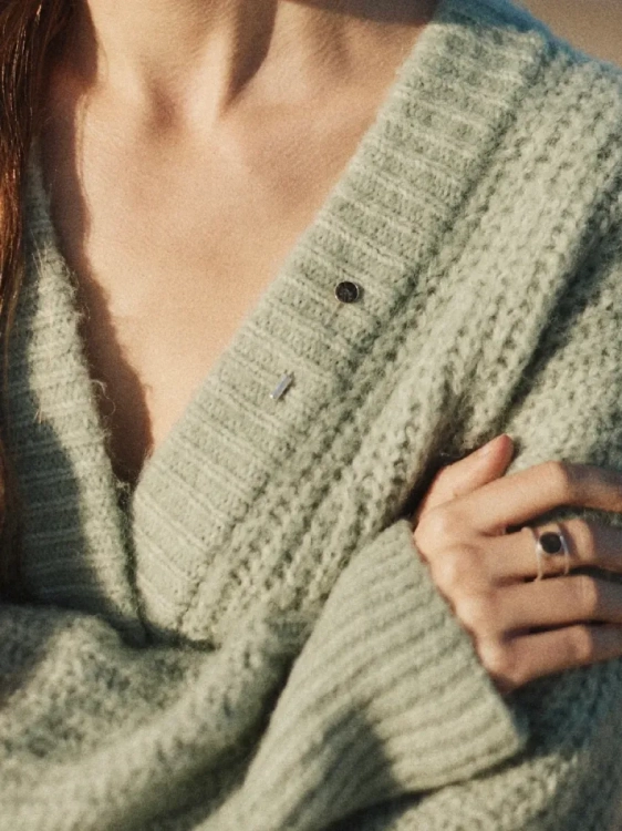 Minimalist silver lapel pin with dark graphite gemstone