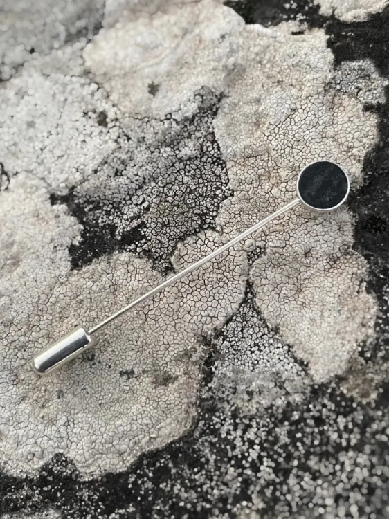 Elegant handmade lapel pin with dark stone