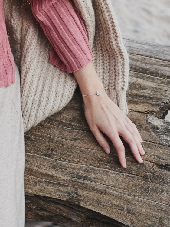 Silver chain bracelet with natural gray dolomite Picasso worn on wrist