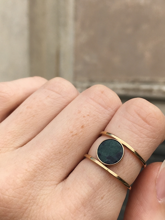 Gold statement ring with deep green nephrite worn on hand – contemporary jewelry