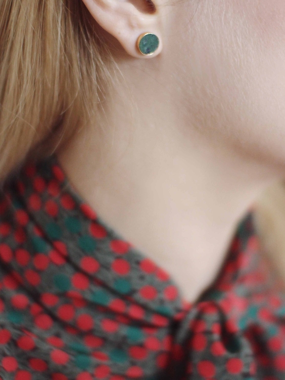 Gold stud earrings with Polish nephrite worn on ear