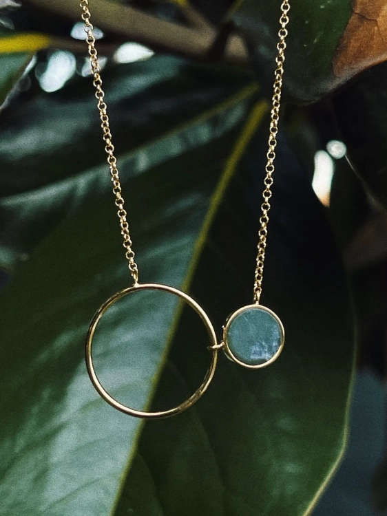 Natural Polish nephrite jade stone close-up in gold setting