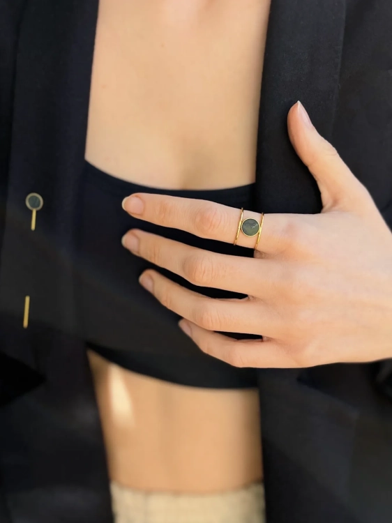 Geometric ring with green stone