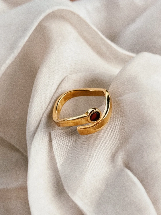 Wave-inspired gold-plated ring with amber, close-up detail