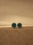 Elegant gold stud earrings with green gemstone accent