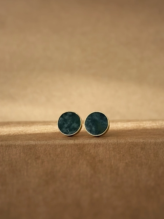 Elegant gold stud earrings with green gemstone accent
