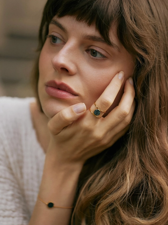 Geometric ring with green stone