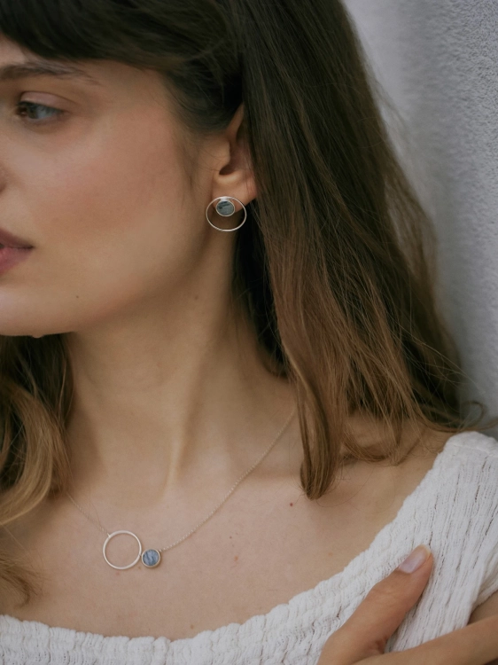 Modern silver hoop earrings featuring gray dolomite Picasso